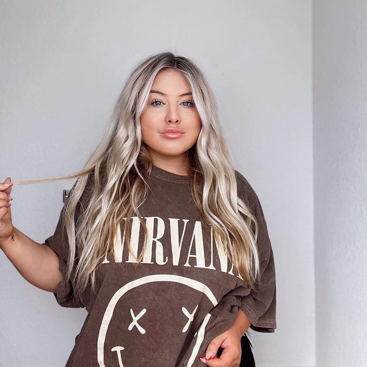 Girl wearing nirvana outlet shirt